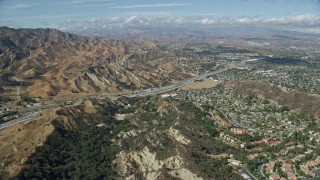 7.6K aerial stock footage of Wiley Canyon Elementary School, storage facilities and retail spaces, Santa Clarita, California Aerial Stock Footage | AX0159_012E