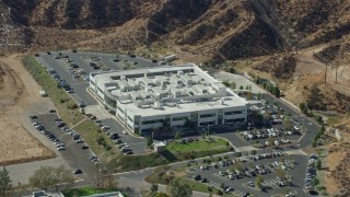 7.6K aerial stock footage orbiting a tech office building and parking lot, Valencia, California Aerial Stock Footage | AX0159_038E