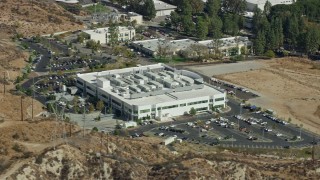 7.6K aerial stock footage passing by front of tech office building, Valencia, California Aerial Stock Footage | AX0159_040E