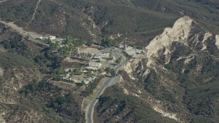 7.6K aerial stock footage of a religious retreat center nestled in the canyons, Sylmar, California Aerial Stock Footage | AX0159_057