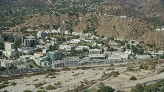 AX0159_081E - 7.6K aerial stock footage of the parking garage and research buildings at JPL, Pasadena, California