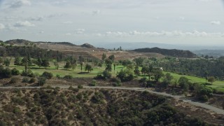 7.6K aerial stock footage of a hilltop golf course, Glendale, California Aerial Stock Footage | AX0159_091