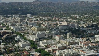 7.6K aerial stock footage orbiting Pasadena City Hall and reveal the Downtown Los Angeles skyline, Pasadena, California Aerial Stock Footage | AX0159_098E