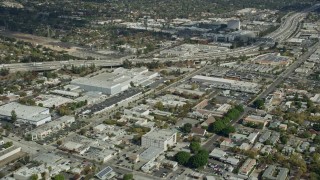 7.6K aerial stock footage of office buildings and a large warehouse beside I-210 in Pasadena, California Aerial Stock Footage | AX0159_111