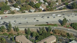 AX0159_119 - 7.6K aerial stock footage orbiting traffic stopped by CHP on the 210 Freeway in Arcadia, CA