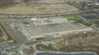 AX0159_126 - 7.6K aerial stock footage of a brewery next to solar panels in Irwindale, California