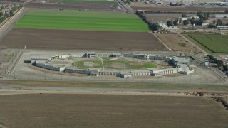 7.6K aerial stock footage of a view of the East Yard at the California Institution for Men, Chino, California Aerial Stock Footage | AX0159_141