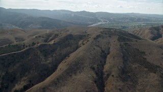 AX0159_155E - 7.6K aerial stock footage flying over tract homes toward freeway, Yorba Linda, California