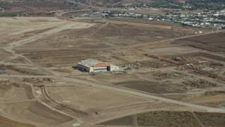 7.6K aerial stock footage of a hangar at an abandoned military airport, Irvine, California Aerial Stock Footage | AX0159_167