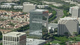 7.6K aerial stock footage orbiting an office building at Irvine Spectrum Center Irvine, California Aerial Stock Footage | AX0159_170