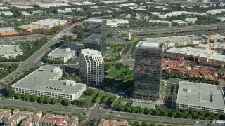 AX0159_172E - 7.6K aerial stock footage orbiting office buildings along Alton Parkway, Irvine, California