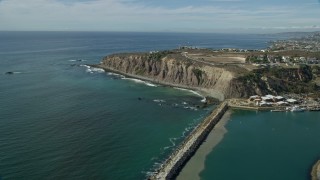 7.6K aerial stock footage flying over Dana Point Harbor and by clifftop mansions in Dana Point, California Aerial Stock Footage | AX0159_198