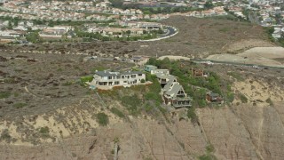 7.6K aerial stock footage of clifftop mansions and Dana Point Nature Interpretive Center in Dana Point, California Aerial Stock Footage | AX0159_199