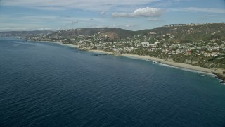 7.6K aerial stock footage of oceanfront homes beside Table Rock Beach, West Street Beach in Laguna Beach, California Aerial Stock Footage | AX0159_204E