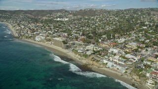 AX0159_209 - 7.6K aerial stock footage of Cactus Point, Arch Cove, Surf and Sand Resort Hotel, Laguna Beach, California