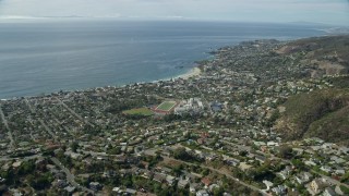 7.6K aerial stock footage flying over homes and Main Beach Park, Laguna Beach, California Aerial Stock Footage | AX0159_217E