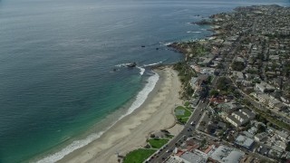 AX0159_222E - 7.6K aerial stock footage flying over coastline and Heisler Park, Recreation Point, Diver's Cove, Laguna Beach, California