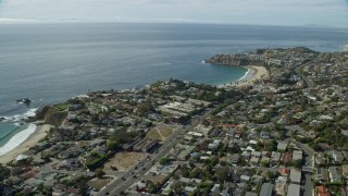 AX0159_225E - 7.6K aerial stock footage orbiting houses on Abalone Point, Laguna Beach, California