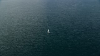 7.6K aerial stock footage approaching a sailboat in open waters, Southern California Aerial Stock Footage | AX0159_234