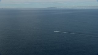 AX0159_235E - 7.6K aerial stock footage tracking a fishing boat in open waters, Southern California