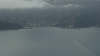 7.6K aerial stock footage approaching the harbor and the island town of Avalon, Catalina Island, California Aerial Stock Footage | AX0159_245