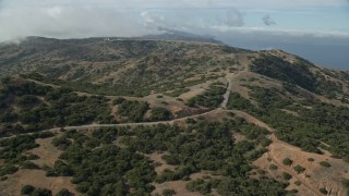 7.6K aerial stock footage approaching the Catalina Airport runway on Santa Catalina Island, California Aerial Stock Footage | AX0159_270E