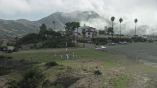 AX0159_273 - 7.6K aerial stock footage coming in for a landing at Catalina Airport on Santa Catalina Island, California