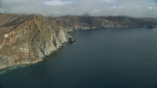 AX0160_015 - 7.6K aerial stock footage of steep cliffs on the coast of Santa Catalina Island, California