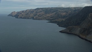 AX0160_020 - 7.6K aerial stock footage of steep cliffs and coastline of Santa Catalina Island, California