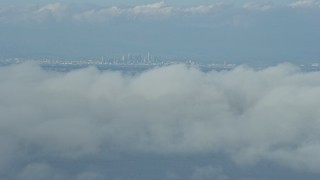 AX0160_025E - 7.6K aerial stock footage of Downtown Los Angeles skyline seen from Catalina Island, California