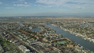 7.6K aerial stock footage approaching the Huntington Harbour residential community in Huntington Beach, California Aerial Stock Footage | AX0160_050E