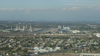 7.6K aerial stock footage of LADWP Haynes Generating Station behind residential neighborhoods in Long Beach, California Aerial Stock Footage | AX0160_054