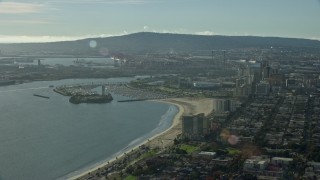 AX0161_004 - 7.6K aerial stock footage of office buildings and marina in Downtown Long Beach, California, with a view of the port