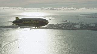 7.6K aerial stock footage of the Goodyear Blimp flying by Downtown Long Beach, California Aerial Stock Footage | AX0161_005