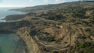 AX0161_023E - 7.6K aerial stock footage flying over beach to approach Palos Verdes Drive, Rancho Palos Verdes, California