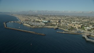 AX0161_036E - 7.6K aerial stock footage flying by Redondo Beach, California and approach King Harbor Marina