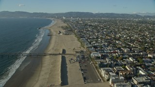 7.6K aerial stock footage flying over the beach toward the Venice Fishing Pier in Venice, California Aerial Stock Footage | AX0161_060E