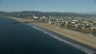 7.6K aerial stock footage flying over beach to approach the Santa Monica Pier, California Aerial Stock Footage | AX0161_067E