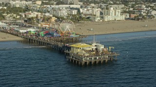 7.6K aerial stock footage of tourists at Santa Monica Pier in Santa Monica, California Aerial Stock Footage | AX0161_080E