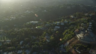 7.6K aerial stock footage of a reverse view of hillside mansions in Beverly Glen, Los Angeles, California Aerial Stock Footage | AX0161_102