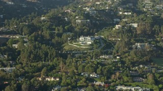 AX0161_108 - 7.6K aerial stock footage flying by a large hillside mansion with manicured grounds in Beverly Hills, California