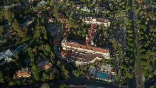 7.6K aerial stock footage of a reverse view of the Beverly Hills Hotel in Beverly Hills, California Aerial Stock Footage | AX0161_110