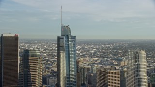 7.6K aerial stock footage flying by the Wilshire Grand Center skyscraper in Downtown Los Angeles, California Aerial Stock Footage | AX0162_013E