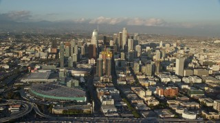 AX0162_036E - 7.6K aerial stock footage of Downtown Los Angeles, California, seen from the interchange and convention center