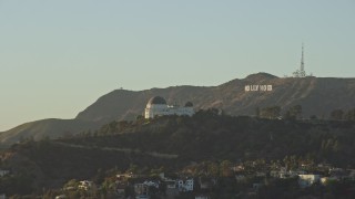 7.6K aerial stock footage orbiting Griffith Observatory to reveal the Hollywood Sign in Los Angeles, California Aerial Stock Footage | AX0162_051E