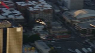 AX0162_055 - 7.6K aerial stock footage tracking an LAPD helicopter flying over Hollywood, California