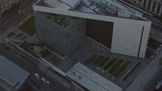 7.6K aerial stock footage orbiting the LAPD headquarters at twilight in Downtown Los Angeles, California Aerial Stock Footage | AX0162_074