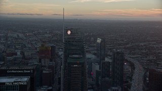 7.6K aerial stock footage of tops of Wilshire Grand Center and US Bank Tower at sunset in Downtown Los Angeles, California Aerial Stock Footage | AX0162_090