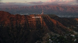 AX0162_101E - 7.6K aerial stock footage of the Hollywood Sign at twilight in Los Angeles, California