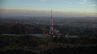 7.6K aerial stock footage orbiting the Hollywood Sign at twilight to reveal Downtown Los Angeles, California  Aerial Stock Footage | AX0162_103